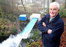 Bob Gilmartin beside his low head waterwheel prototype