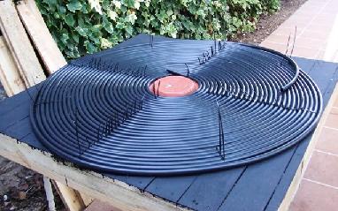 Coiling black hose to make a solar collector