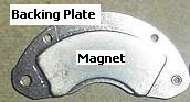 Hard disk drive magnet still attached to backing plate