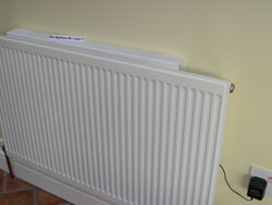 Radiator Booster sat on top of a standard domestic radiator