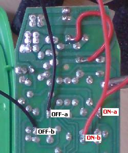 Soldering wires onto the button contacts on the underside of the Standby Buster circuit board