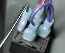 Spade connectors on an automotive relay