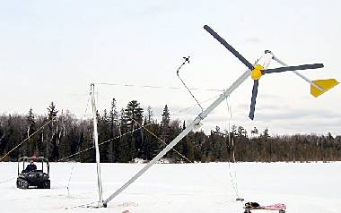 Tilt-up wind turbine tower being winched up