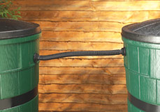 Two water butts connected together to double water storage capacity