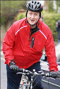 David Cameron riding his bicycle to work