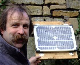 Dick Strawbridge and a Solar Panel used to power PC fan in a greenhouse heatsink system