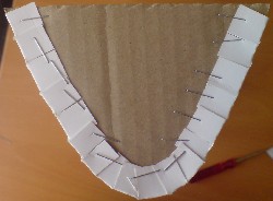 End view of parabolic trough prototype. Staples used to hold mirrored card to end supports