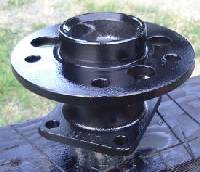 Salvaged wheel hub used as wind turbine hub