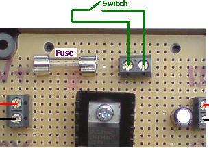 12 VOLT REGULATOR WITH FUSE AND SWITCH TERMINALS. Supply a fixed 12.0 Volt DC to your devices (up to 1 Amp output). Includes fitted 1A fuse, 2 spare fuses, and terminals for connection of a switch